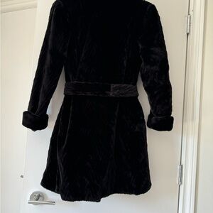 Beautiful knee length black women’s fur coat